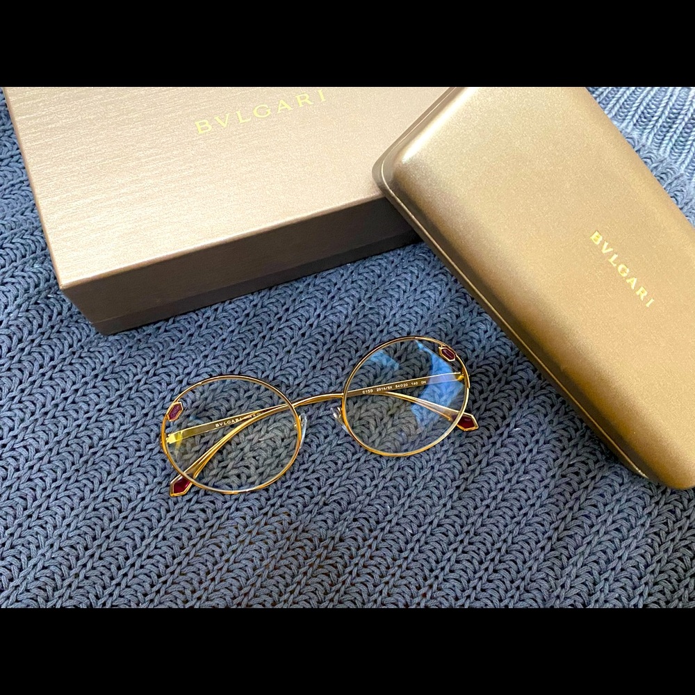 Bvlgari 6159 Serpenti glasses. Round shape with gold hardware and pink gem.